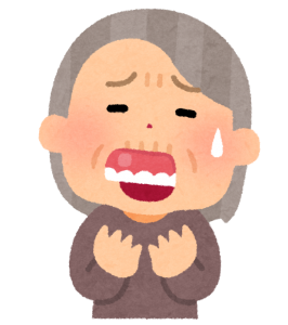入れ歯が外れて困っているお婆さんの画像